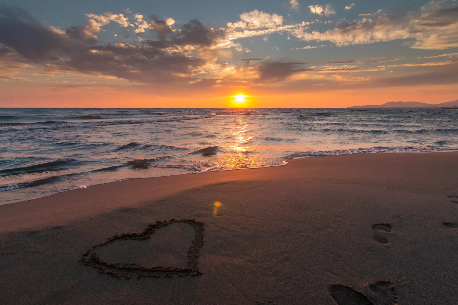 A romantic beach shoot with the sunset behind you